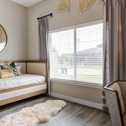 a bedroom with a large mirror