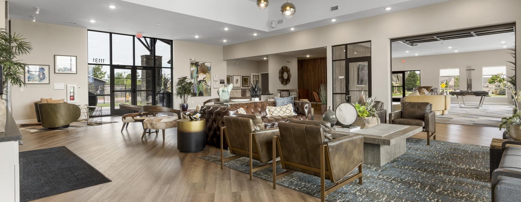 a large living room with a large rug and a large glass door