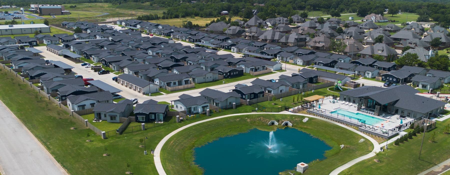 a large pool surrounded by houses
