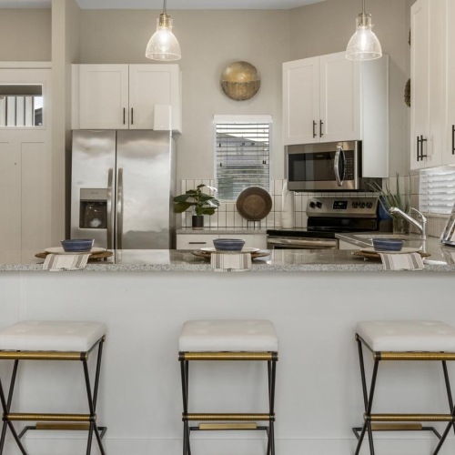 a kitchen with white cabinets