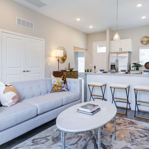 a living room with a couch and a table