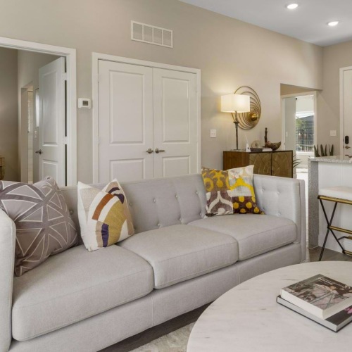 a living room with a couch and a table